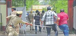  ?? ANIL K MAURYA/TPHOTO ?? A policeman canes a protester in Allahabad on Tuesday.