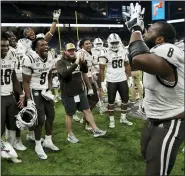  ?? CARLOS OSORIO — THE ASSOCIATED PRESS ?? Western Michigan defensive lineman Ralph Holley, right, an Orchard Lake St. Mary’s graduate, celebrates the Broncos’ win over Nevada in Monday’s Quick Lane Bowl in Detroit.