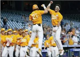  ?? MICHAEL WYKE - THE ASSOCIATED PRESS ?? FILE - Tennessee’s Jordan Beck (27) and Jorel Ortega, right, jump in celebratio­n of Beck’s home run against Oklahoma during an NCAA baseball game on Sunday, March 6, 2022, in Houston.