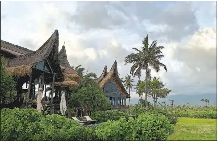  ??  ?? This spectacula­r long house, based on a traditiona­l Sumatran design, is the main building in a six-villa oceanfront complex on Bali’s east side. It was built by American film director Rob Cohen.