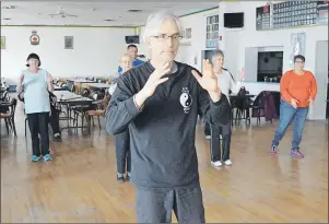  ?? DAVID JALA/CAPE BRETON POST ?? Instructor Michael Milburn leads a group of cancer patients and survivors through some slow and gentle movements during the weekly tai chi session he leads on Thursday afternoons at the Whitney Pier legion. Put on by the Cape Breton Cancer Centre, the...