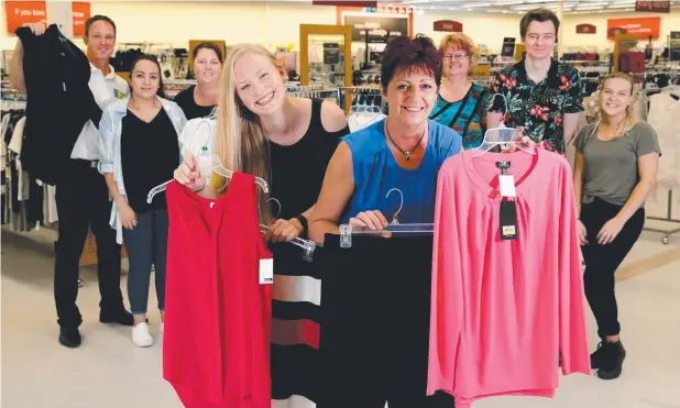  ?? Picture: ANNA ROGERS ?? BAG A BARGAIN: TK Maxx sales assistant Aliesha Smith and store manager Pauline Lawless (in front) with DFO centre manager Alex Stagg, and other TK Maxx staff members Rebecca Riberio, Sharon Daddow, Jillian Taylor, Nathan Taylor and Kaycey Brewster.