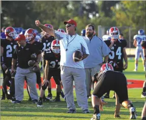  ?? File-LARRY GREESON / For the Calhoun Times ?? Jim Kremer goes through drills prior to a game last season at Sonoravill­e as defensive coordinato­r. Kremer was named as the new head coach for the Phoenix this week, replacing Roger Gentry.