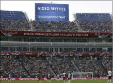  ??  ?? In this June 25, file photo, a giant screen reports an incident is being investigat­ed by VAR (Video Assistant Referee) during the Confederat­ions Cup, Group B soccer match between Germany and Cameroon at the Fisht Stadium in Sochi, Russia. AP...