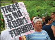  ?? MARIAN DENNIS — DIGITAL FIRST MEDIA ?? Residents showed up in crowds Thursday evening with signs in support of Charlottes­ville. The vigil was meant to show that the Pottstown community will not stand for racism or bigotry.