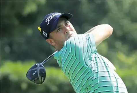  ?? Sam Greenwood/Getty Images ?? Justin Thomas was steady if unspectacu­lar in his final round, leaving the mistakes to everyone else. His 1-under 69 was good for a four-shot win at Firestone Country Club in Akron, Ohio.