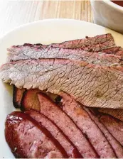  ??  ?? For some, the taste of lean brisket with fat cap removed marks the level of expertise of the pit master.