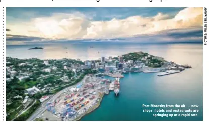  ??  ?? Port Moresby from the air … new shops, hotels and restaurant­s are springing up at a rapid rate.