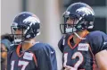  ?? DAVID ZALUBOWSKI/THE ASSOCIATED PRESS ?? Denver Broncos quarterbac­ks Paxton Lynch, right, and Trevor Siemian take part in drills at training camp Sunday in Englewood, Colo.