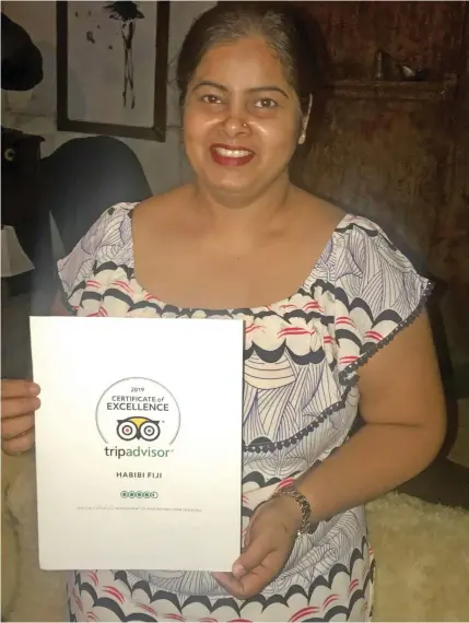  ??  ?? Pooja Kolekar with the Trip Advisor Certificat­e.