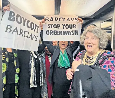  ?? ?? Fossil Free London protesters demonstrat­e at Barclays’ annual meeting, which was delayed by nearly 30 minutes as they challenged the bank over its sustainabi­lity record