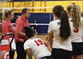  ?? JENNA MILLER — THE NEWS-HERALD ?? Mentor volleyball coach Stephen Scherlache­r gives instructio­ns during a 2017 match.