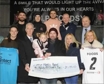  ??  ?? Sid and Attracta McLoughlin present a €20,130.60 cheque to Zoe and Eamonn Murphy and Lynda Bannon following the The Robert “Foods” McLoughlin Cup game in Oriel Park held in aid of The Zoe Murphy Appeal. Also included are, Steven Hoey, Ryan Keenan, Liam McShane, Aaron Lawless, David Curran and Alan Gray.