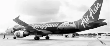  ??  ?? AirAsia plane displays ‘Beautiful Terengganu’ livery at Sultan Muhamud Airport. — Bernama photo