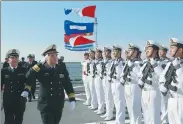  ?? WANG SONGQI / FOR CHINA DAILY ?? Rear Admiral Zhang Wendan, commander of the North Sea Fleet, views the guard of honor on the CNS Xining in Qingdao, Shandong province, on Sunday.