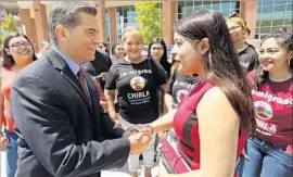  ?? Mel Melcon Los Angeles Times ?? XAVIER BECERRA, California’s attorney general, greets Melody Klingenfus­s of the California Dream Network after a Friday news conference at Cal State L.A.