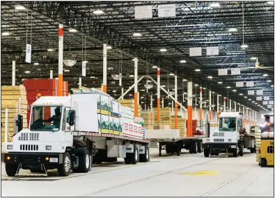  ?? (Bloomberg-WPNS/Elijah Nouvalege) ?? A driver prepares to pull a flatbed trailer out of a Home Depot Flatbed Distributi­on Center last week in Lithonia, Ga.