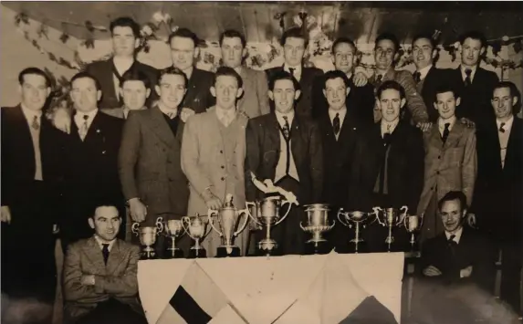  ??  ?? Silverware galore at a Castlemagn­er GAA function in 1952.