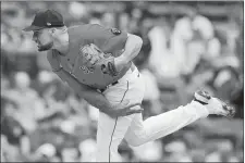  ?? MICHAEL DWYER/AP PHOTO ?? Boston Red Sox’ pitcher Nathan Eovaldi throws during the first game of a doublehead­er on Saturday against the Baltimore Orioles.