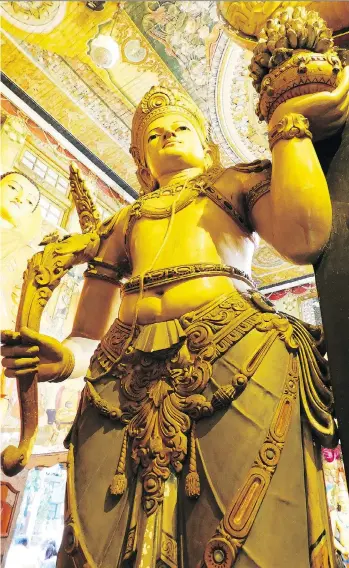  ?? PHOTOS: LUCAS AYKROYD ?? Statues of goddesses and demons decorate the Gangaramay­a Temple in Colombo.