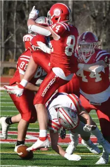  ?? CHRiS cHRiSTO pHOTOS / HERaLD STaFF ?? SHAKING OFF THE RUST: Catholic Memorial’s Brady McGowan blocks a punt by St. John’s of Shrewsbury’s Noah Moselhy on Saturday in Shrewsbury. At left, CM’s Jaden Skeete hauls in a pass.