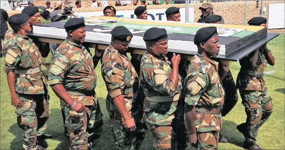  ?? CAKE TIME:
Picture: Danie van der Lith ?? ANC military veterans are seen bringing in the cake for the birthday celebratio­ns.