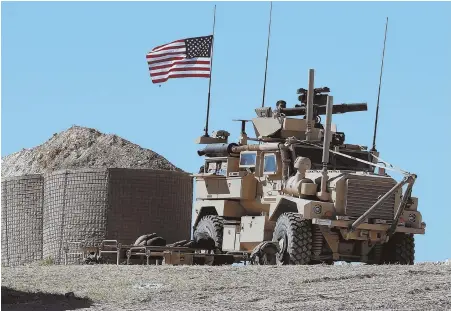  ?? AP FILE PHOTO ?? `A REAL SOUP OF THINGS THAT COULD GO WRONG’: Last week, a U.S. soldier sits on an armored vehicle at an installed position near the tense front line between a U.S.-backed coalition and hostile groups, in Manbij, Syria.