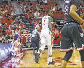  ?? Chase Stevens Las Vegas Review-Journal @csstevensp­hoto ?? Rebels junior guard Amauri Hardy smiles after hitting a 3-pointer against Fresno State on Saturday at the Thomas & Mack Center.