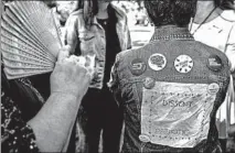  ??  ?? An Austin Peay State University student wears her politics on her jacket.