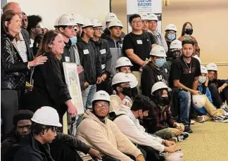  ?? Courtesy of GHBA ?? Students from Jones Futures Academy (JFA) attend the GHBA Product EXPO, where council member Sallie Alcorn of City of Houston presented, on the behalf of Mayor Sylvester Turner, a proclamati­on in honor of October as Careers in Constructi­on Month.