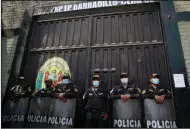  ?? (AP/Guadalupe Pardo) ?? Police guard the jail where former Peruvian President Alberto Fujimori is being held Tuesday in Lima, Peru.