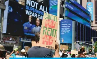  ?? — AFP ?? In this file photo, protesters rally demanding economic relief during the coronaviru­s pandemic, at Time Square in New York City.