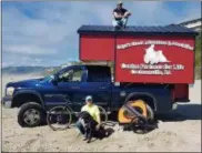  ?? SUBMITTED PHOTO ?? Ron Storms and his black Labrador, Onyx, have biked across the country, from Oregon to Pennsylvan­ia, to raise money and awareness for Canine Partners for Life.