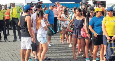  ??  ?? ‘M/V Monarch’ passengers waiting to be transporte­d to attraction­s in Kingston and St Andrew.