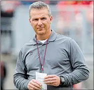  ?? AP file photo ?? Ohio State Coach Urban Meyer was placed on paid administra­tive leave Wednesday as the school investigat­es claims that several people close to former assistant coach Zach Smith, including Meyer, knew of a 2015 allegation of domestic violence against Smith made by his ex-wife.