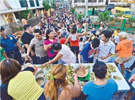  ?? (SUN.STAR FOTO/AMPER CAMPAñA) ?? FIESTA. Barangay Suba, Cebu City recently held its Tuslob-Buwa Festival, which signals the start of the village’s fiesta celebratio­n. Their fiesta day falls on the same day as the Sinulog Festival.