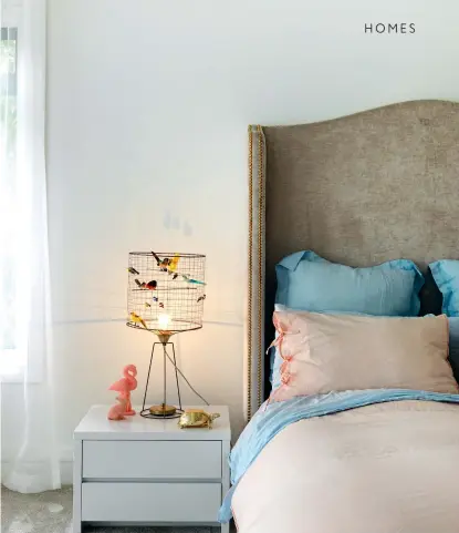  ??  ?? THIS PAGE Michelle wanted Christelle’s bedroom to be one that every girl dreams of; it includes a Volière Haute table lamp from ECC and the studded headboard was custom designed.