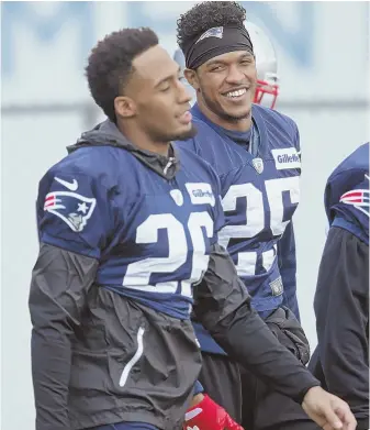  ?? STAFF PHOTO BY JOHN WILCOX/AP PHOTO (BELOW) ?? LIGHTING IT UP: Cornerback Eric Rowe, right, enjoys a laughs with teammate Logan Ryan as they walk onto the field for Patriots practice at Gillette Stadium yesterday. Below, Rowe makes one of the marquee stops of the season, breaking up a pass intended...