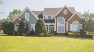  ??  ?? This custom home in Chickamaug­a boasts great views and a 13-stall horse barn.