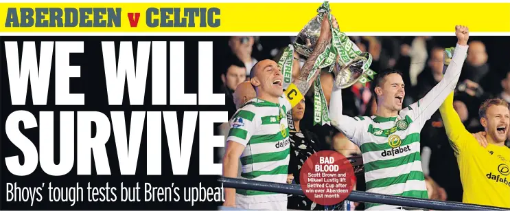  ??  ?? BAD BLOOD Scott Brown and Mikael Lustig lift Betfred Cup after win over Aberdeen last month