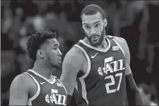  ?? DUANE BURLESON/AP PHOTO ?? Jazz center Rudy Gobert (27) talks with guard Donovan Mitchell during the second half of a game against the Pistons on March 7.
