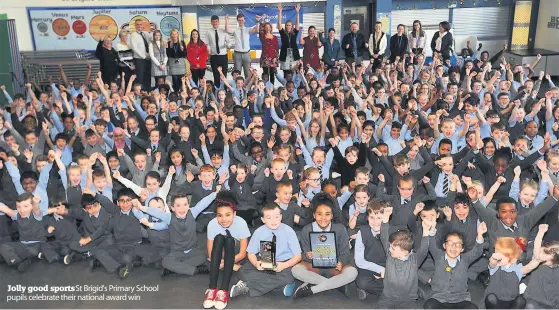  ??  ?? Jolly good sports St Brigid's Primary School pupils celebrate their national award win