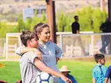  ?? COURTESY OF LANA MELENDRES-GROVES ?? Former UNM soccer player Lana MelendresG­roves, here with her son Charlie, values coaching as a release from her duties as a doctor, fighting the coronaviru­s.