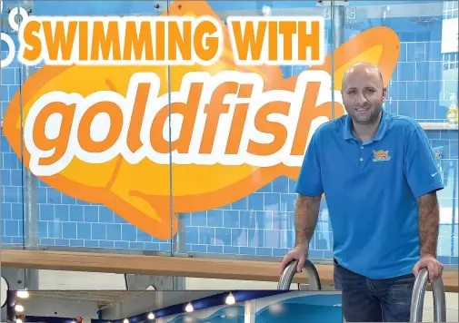  ?? PETE BANNAN - MEDIANEWS GROUP
PETE BANNAN - MEDIANEWS GROUP ?? Greg DeRise stands in front of the 75x 2560,000gallon pool which is kept at 90degrees. DeRise and his wife Alexandra along with Anthony Pistilli are business partners in the new franchise Goldfish Swim School at The Promenade at Granite Run. They also have another location in East Whiteland, Chester County.
Greg DeRiseof Devonhas opened his second swim school with his wife Alexandra and business partner Anthony Pistilli of Media. The school is Goldfish Swim School of Media. Iit is located at The Promenade at Granite Run.