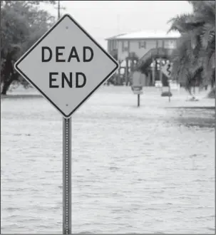  ?? The Associated Press ?? RISING WATER: Water levels rise after a combinatio­n of high tide and the rain from Tropical Storm Cindy Thursday in Lake Charles, La.