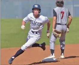  ?? Dan Watson/The Signal inning against hart at ?? Blake Schroeder (20) heads to third base in the first West Ranch High.