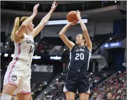  ?? JESSICA HILL — THE ASSOCIATED PRESS ?? Villanova’s Maddy Siegrist, right, shoots over UConn’s Dorka Juhasz last month in Hartford, Conn.