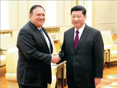  ?? FENG YONGBIN / CHINA DAILY ?? President Xi Jinping greets US Secretary of State Mike Pompeo at the Great Hall of the People in Beijing late on Thursday. Xi stressed Beijing’s support for further cooperatio­n between Washington and Pyongyang.