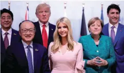  ??  ?? From left: Japan’s Prime Minister Shinzo Abe, World Bank President Jim Yong Kim, Trump, Ivanka, Merkel and Trudeau pose for a photo at the Women’s Entreprene­urship Finance event during the G20 leaders summit in Hamburg, Germany on Saturday.