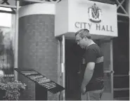  ?? CHAD HIPOLITO / THE CANADIAN PRESS ?? A plaque outside city hall in Victoria, B.C., which replaced a bronze statue of Sir John A. Macdonald, was vandalized after the removal of the statue over the weekend.